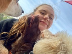 Woman smiling with dogs